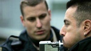 Police Administering PBT for DUI Portable Breathalyzer
